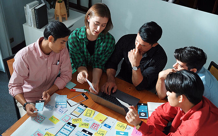 Creative team reviewing logo ideas and designs. 