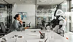 Side view of a smiling Asian businesswoman engaging in a conversation with a robot in a modern conference hall, emphasizing a professional and futuristic atmosphere.
